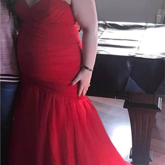 This gorgeous red prom dress is a size 20 but it definitely fits smaller. - Picture 3 of 4